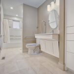 Accessible vanity, fold-down toilet grab bars, tilt-mirror; Accessible bathroom Renovation Mississauga