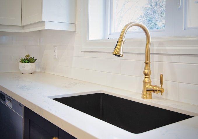 Gold colour kitchen faucet; undermount kitchen sink.